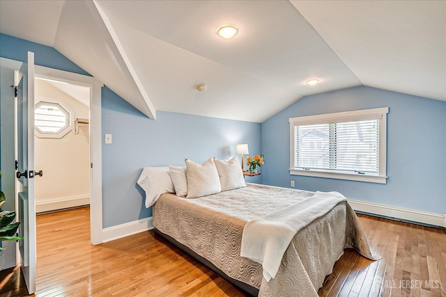 205 Midland Ave, Metuchen, NJ 08840 - bedroom featuring a baseboard radiator, lofted ceiling, and wood finished floors