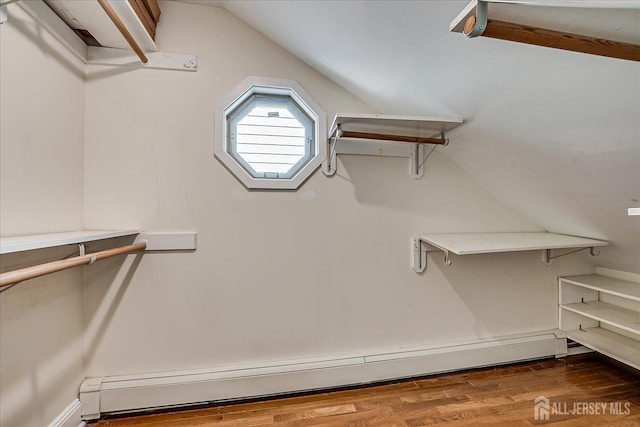 205 Midland Ave, Metuchen, NJ 08840 - walk in closet featuring baseboard heating, vaulted ceiling, and wood finished floors