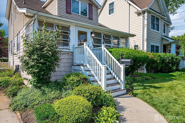 205 Midland Ave, Metuchen, NJ 08840 - view of front of house with a front lawn and a shingled roof