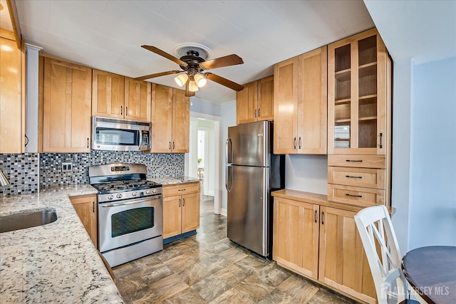 205 Midland Ave, Metuchen, NJ 08840 - kitchen featuring appliances with stainless steel finishes, tasteful backsplash, ceiling fan, and light stone countertops