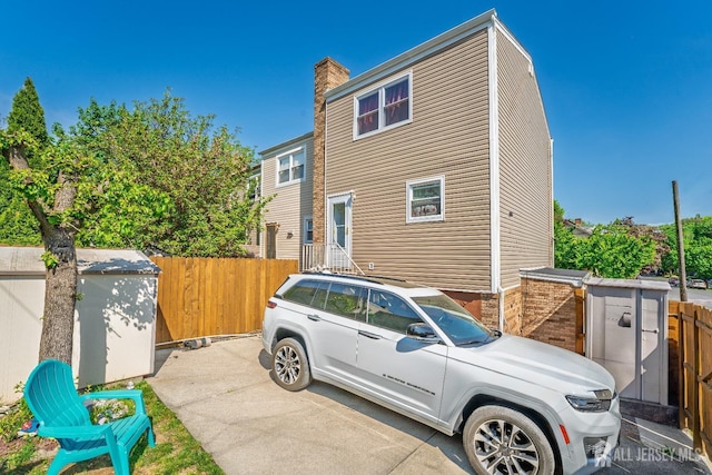 view of home's exterior with fence