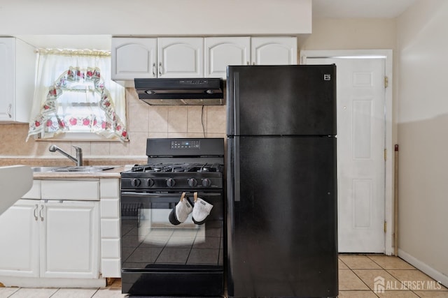 kitchen featuring black appliances, exhaust hood, light tile patterned flooring, and white cabinets