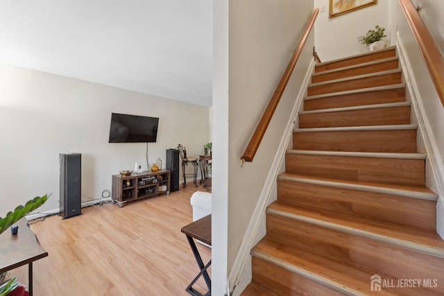 stairway with wood finished floors