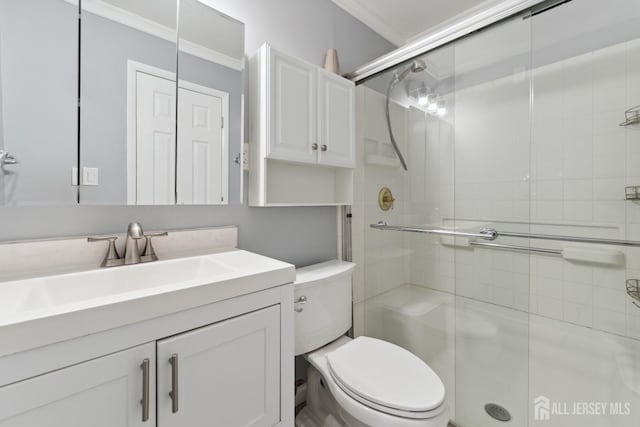 137 Paul Robeson Blvd Unit B, New Brunswick, NJ 08901 - bathroom featuring ornamental molding, toilet, a shower stall, and vanity