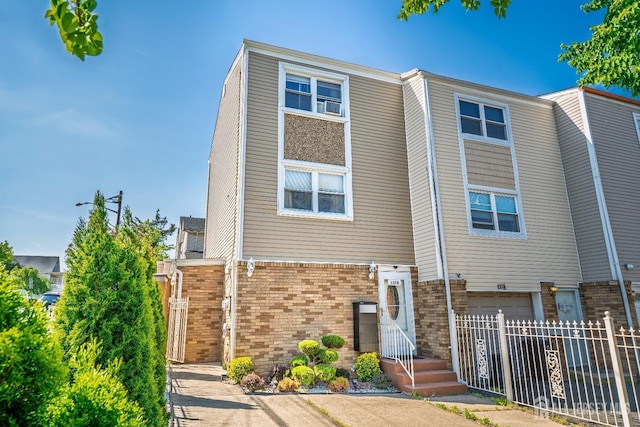137 Paul Robeson Blvd Unit B, New Brunswick, NJ 08901 - multi unit property with brick siding, an attached garage, and cooling unit