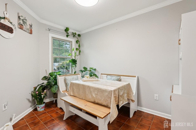 dining space with crown molding, tile patterned flooring, and baseboards