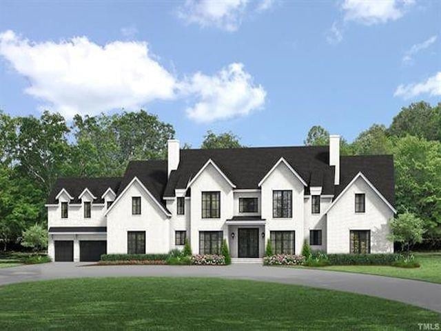 view of front facade featuring a front lawn and a garage