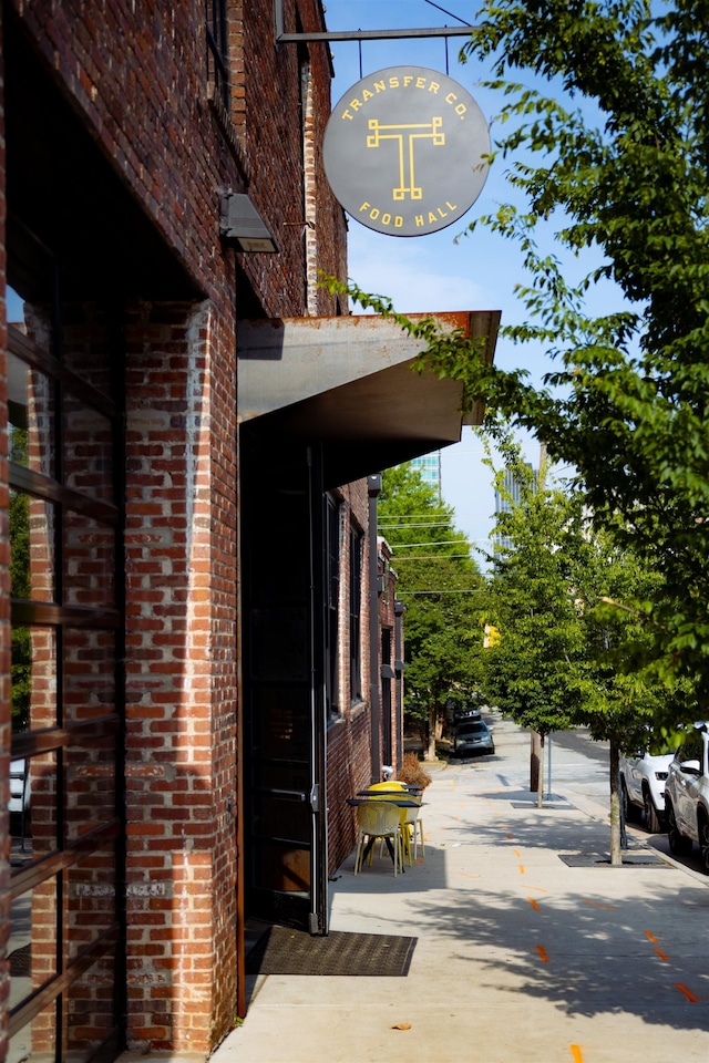 exterior space with brick siding