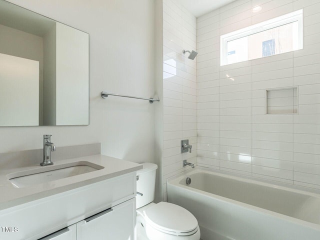 bathroom with bathing tub / shower combination, vanity, and toilet