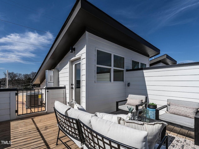 deck featuring an outdoor living space and fence