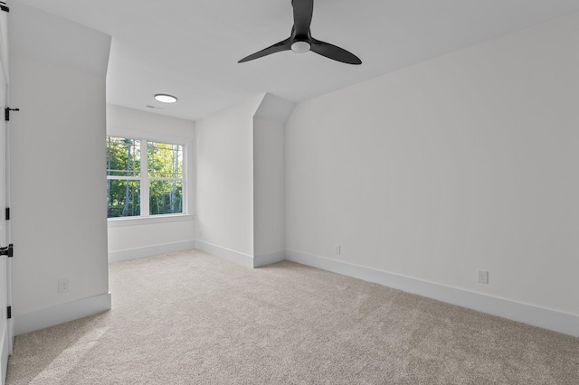 empty room featuring light carpet and ceiling fan