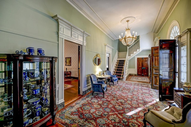 interior space featuring an inviting chandelier, ornamental molding, and dark wood-type flooring