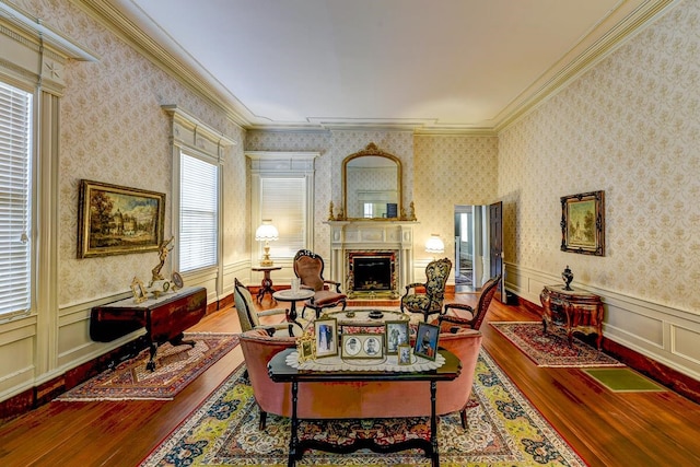 living room with dark hardwood / wood-style flooring and crown molding