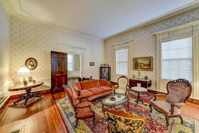 living room with plenty of natural light, crown molding, and dark wood-type flooring