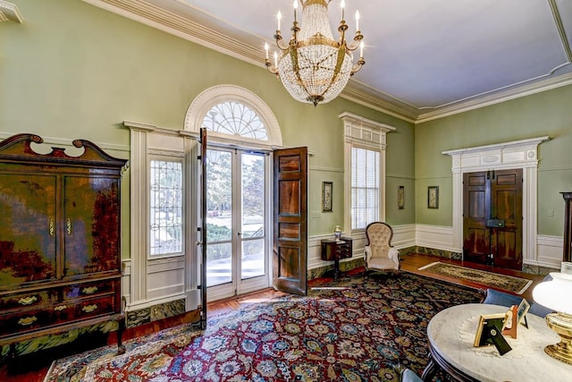 interior space featuring an inviting chandelier, crown molding, and dark wood-type flooring