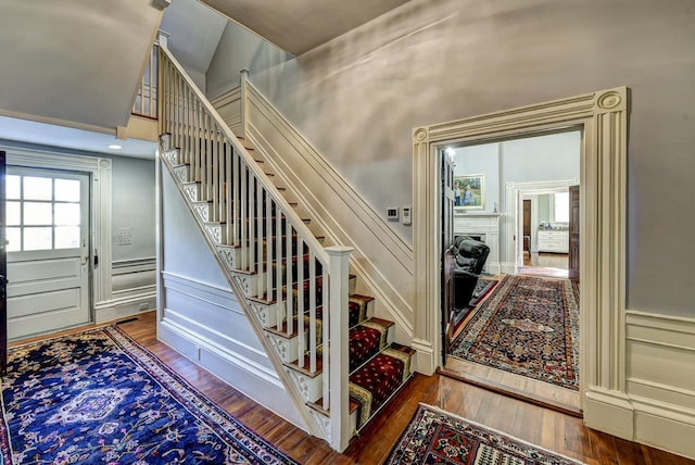 stairway with dark wood-type flooring