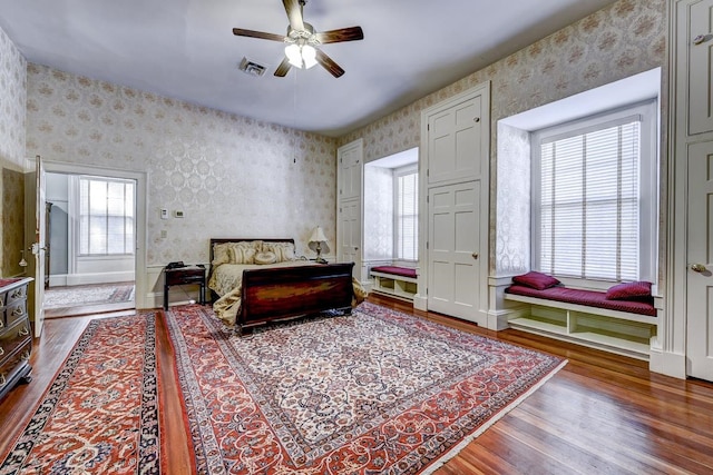 bedroom featuring dark hardwood / wood-style flooring and ceiling fan