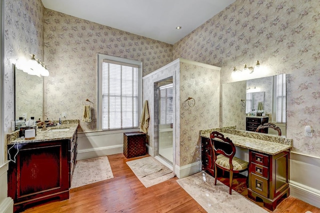 bathroom featuring vanity, a shower with door, and hardwood / wood-style flooring