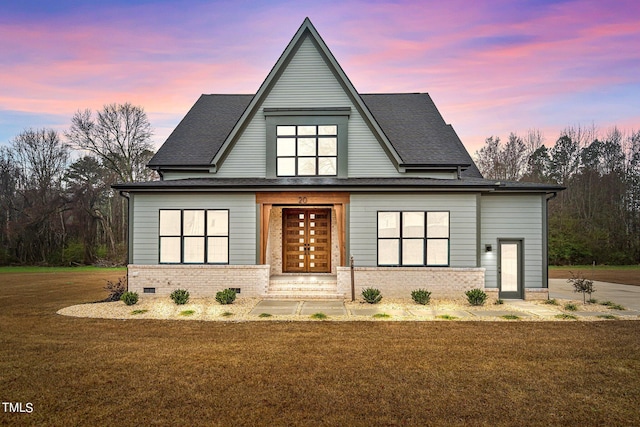 view of front of property with a lawn