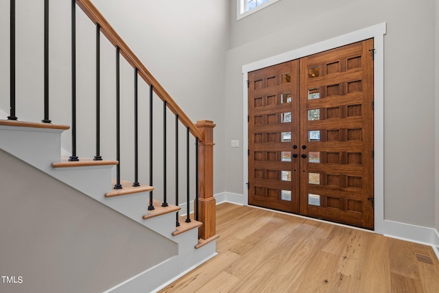 foyer entrance with light hardwood / wood-style flooring