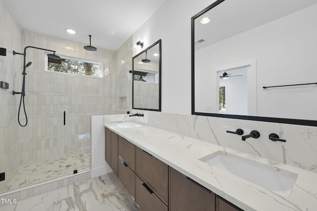 bathroom with vanity and a shower with door