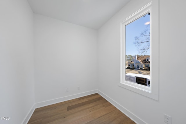 unfurnished room featuring hardwood / wood-style flooring