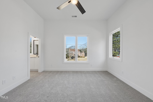 carpeted empty room with ceiling fan