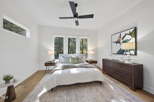 bedroom featuring light hardwood / wood-style flooring and ceiling fan