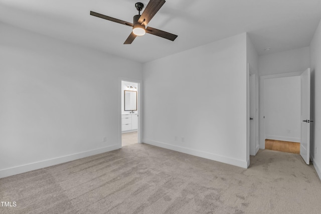 2601 Mayview Rd, Raleigh, NC 27607 - unfurnished bedroom with baseboards, ensuite bathroom, a ceiling fan, and carpet flooring