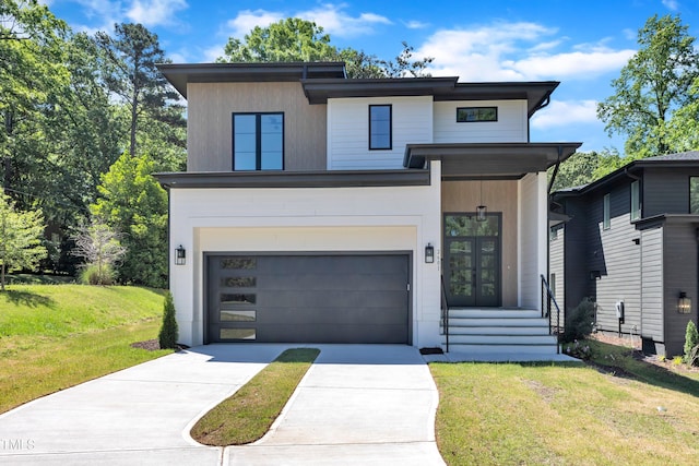 2601 Mayview Rd, Raleigh, NC 27607 - modern home featuring concrete driveway, an attached garage, french doors, and a front lawn