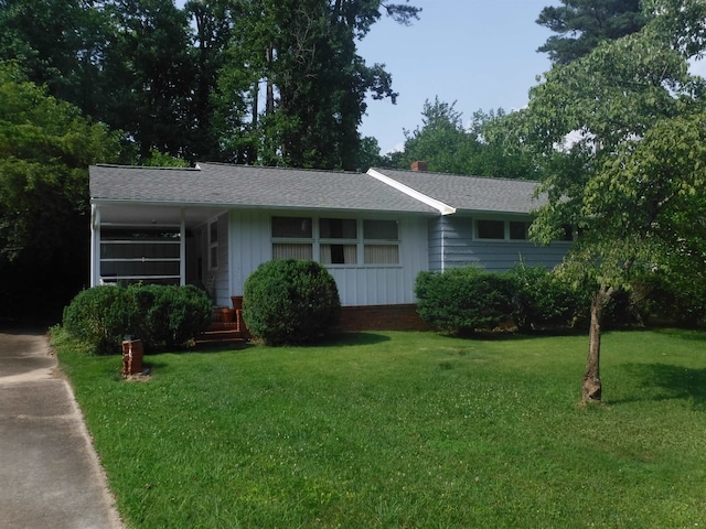 3418 Leonard St, Raleigh, NC 27607 - ranch-style house featuring a front lawn and roof with shingles