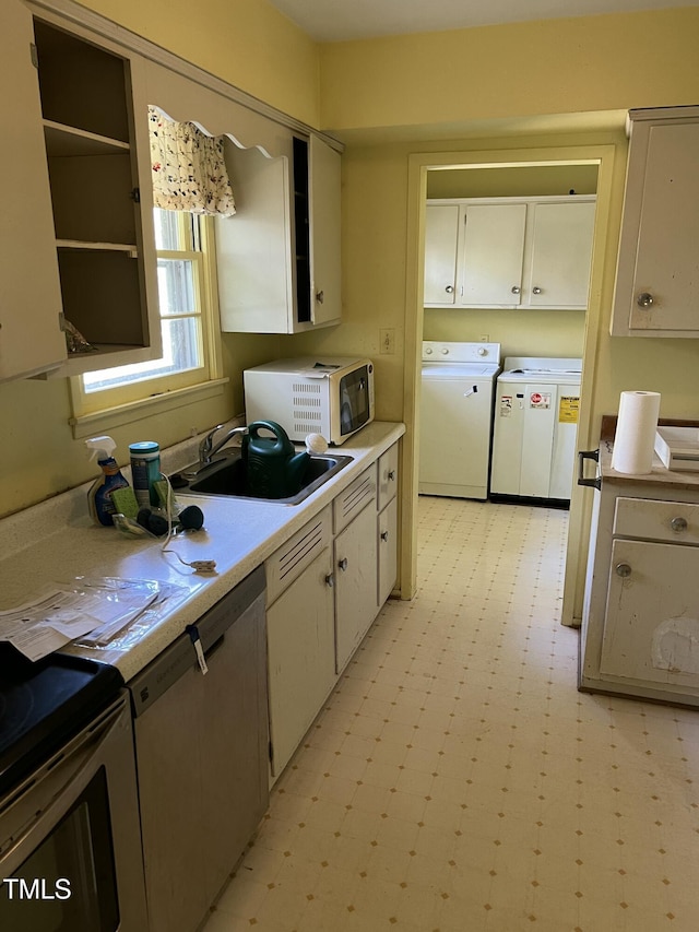 kitchen featuring washer and clothes dryer, sink, and dishwasher