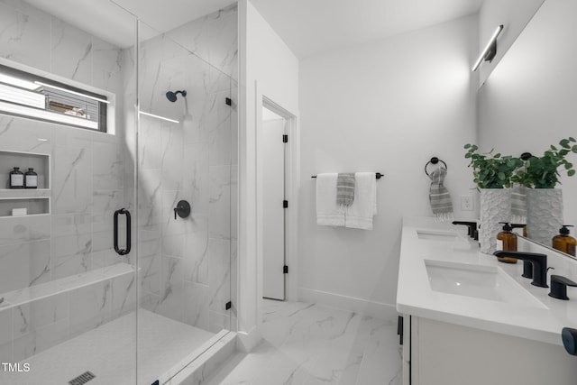 bathroom featuring vanity and an enclosed shower