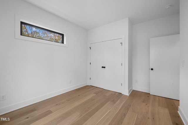 unfurnished bedroom with light hardwood / wood-style floors