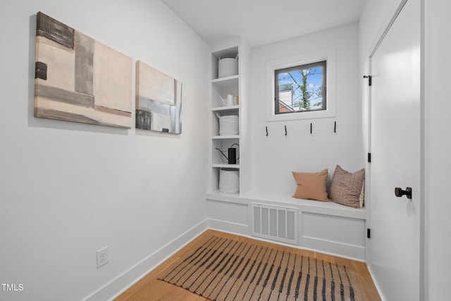 mudroom with hardwood / wood-style flooring