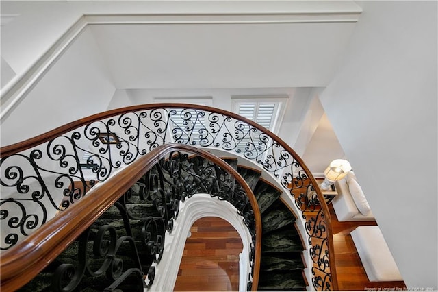 stairway featuring hardwood / wood-style flooring