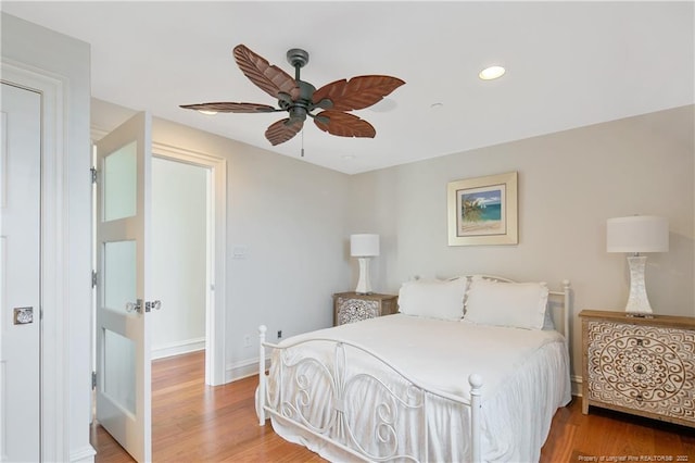 bedroom featuring wood-type flooring and ceiling fan