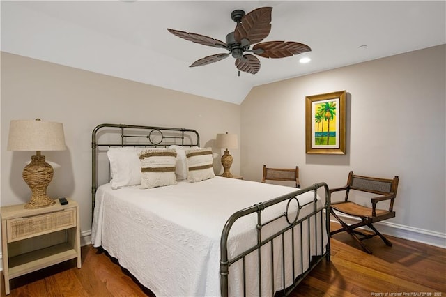 bedroom featuring ceiling fan, lofted ceiling, and dark hardwood / wood-style flooring