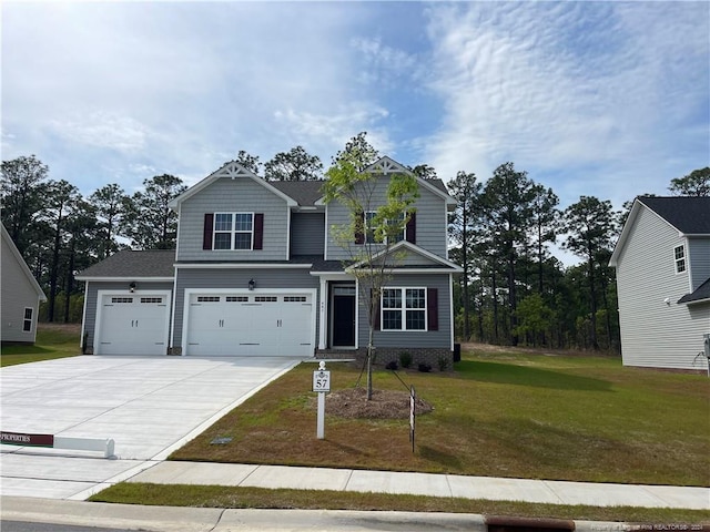 view of front of property featuring a garage and a front yard