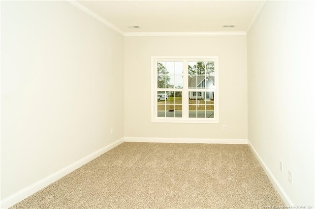 carpeted spare room with ornamental molding