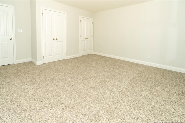 unfurnished bedroom with light carpet