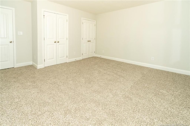 unfurnished bedroom featuring light colored carpet