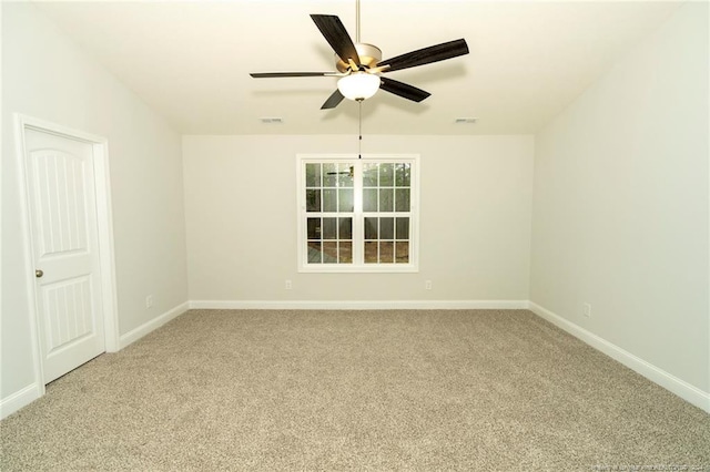 carpeted empty room featuring ceiling fan