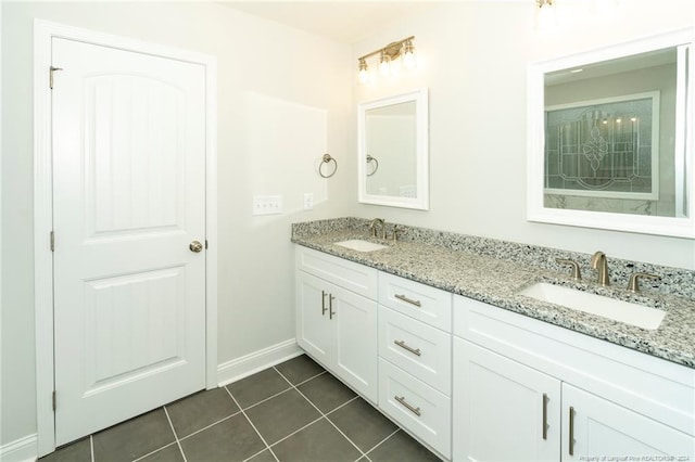 bathroom with tile flooring and double sink vanity
