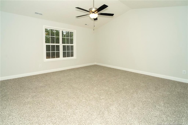empty room featuring carpet, ceiling fan, and lofted ceiling