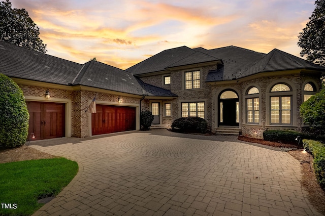 french country home with a garage