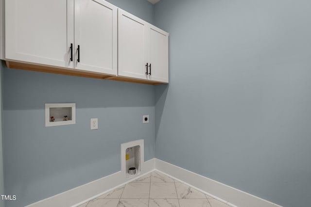 clothes washing area with electric dryer hookup, hookup for a washing machine, light tile floors, and cabinets