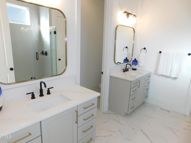 bathroom featuring walk in shower and vanity