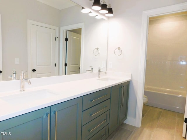 bathroom with vanity, tile patterned floors, and toilet