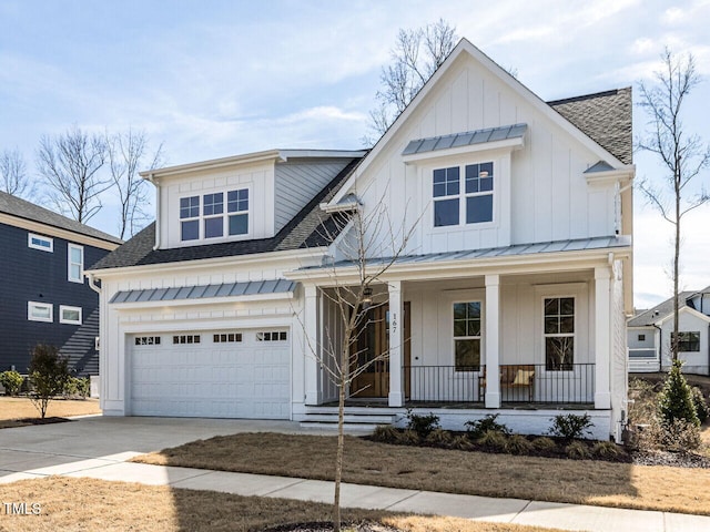 modern inspired farmhouse featuring a shingled roof, a porch, an attached garage, board and batten siding, and driveway